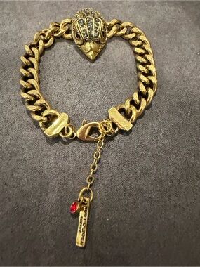 Kurt Geiger Gold-Tone Eagle Head Link Bracelet with Red Charm